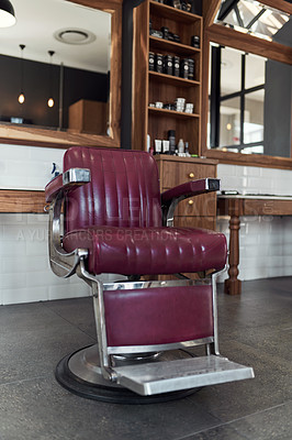 Buy stock photo Still life shot of barber chair inside an empty barbershop