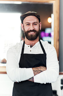 Buy stock photo Portrait of a handsome young barber posing inside his barbershop