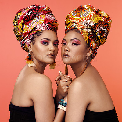 Buy stock photo African fashion, makeup and portrait of women on orange background with accessory, makeup and beauty. Glamour, luxury and female people in exotic jewelry, traditional style and head scarf in studio