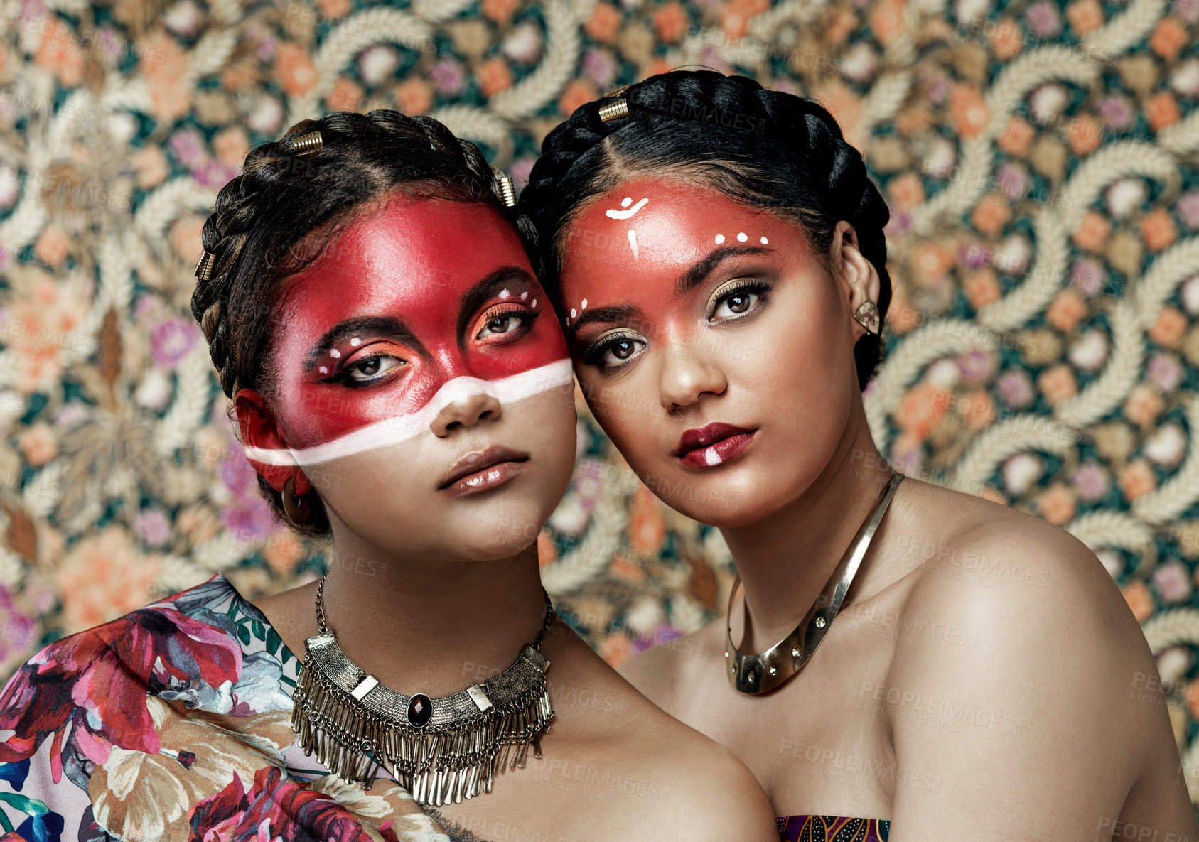 Buy stock photo Culture, makeup and portrait of girls, traditional and art on face, color and respect for religion. Pattern, background and twins of women, proud and confident with paint, red and together or beauty