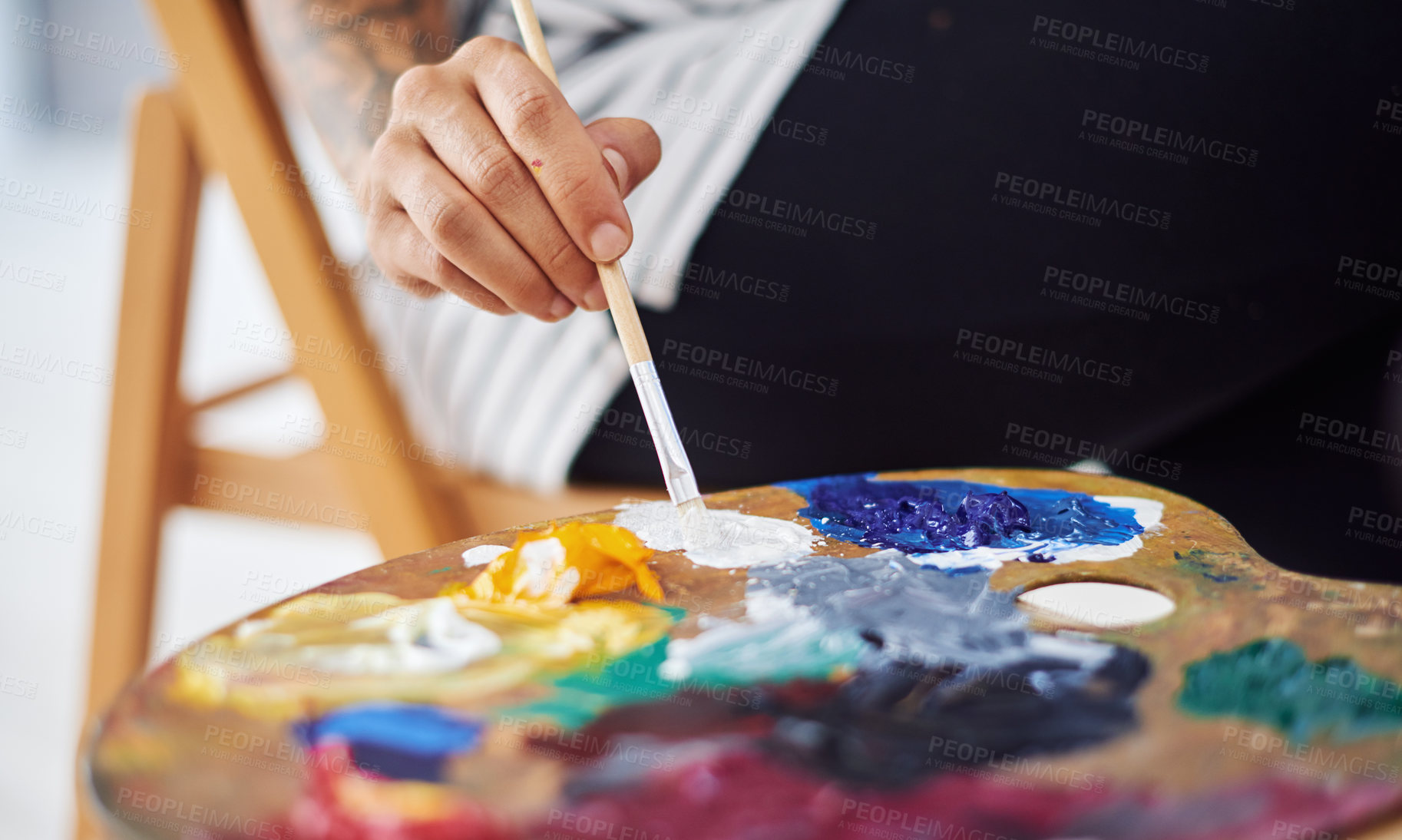 Buy stock photo Person, hands and painter with palette in closeup for blending sustainable oil paint and creative expression. Paintbrush, mixing tool and art project with eco friendly materials for inspiration 