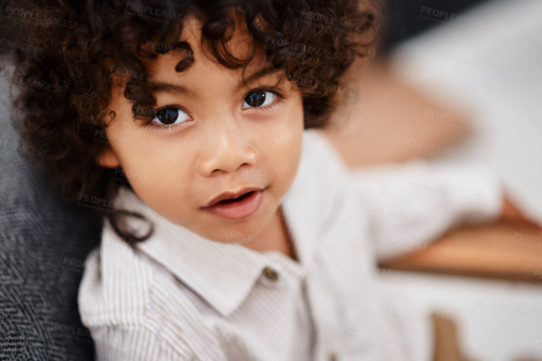 Buy stock photo Portrait, boy and kid on couch, relax and happiness in living room for break, playful and chilling. Face, apartment and childhood with fun, smile and development with curly hair and weekend activity