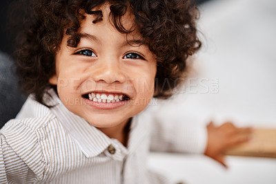 Buy stock photo Portrait of an adorable little boy relaxing and enjoying himself at home