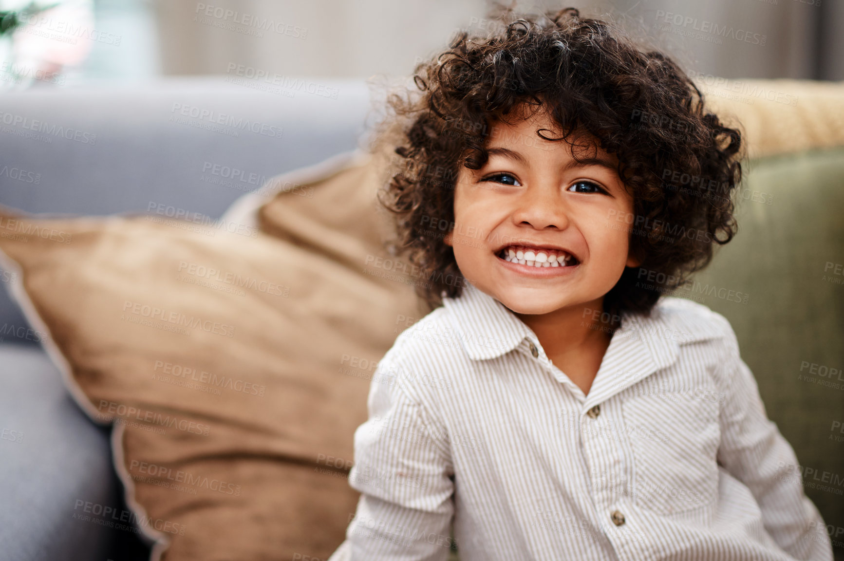 Buy stock photo Portrait, boy and kid on couch, smile and happiness in living room for break, relax and chilling. Face, apartment and childhood with fun, playful and development with curly hair and weekend activity