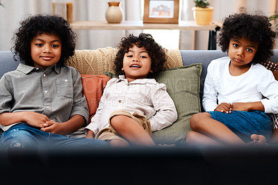 Buy stock photo Cropped shot of three adorable little boys watching movies together at home