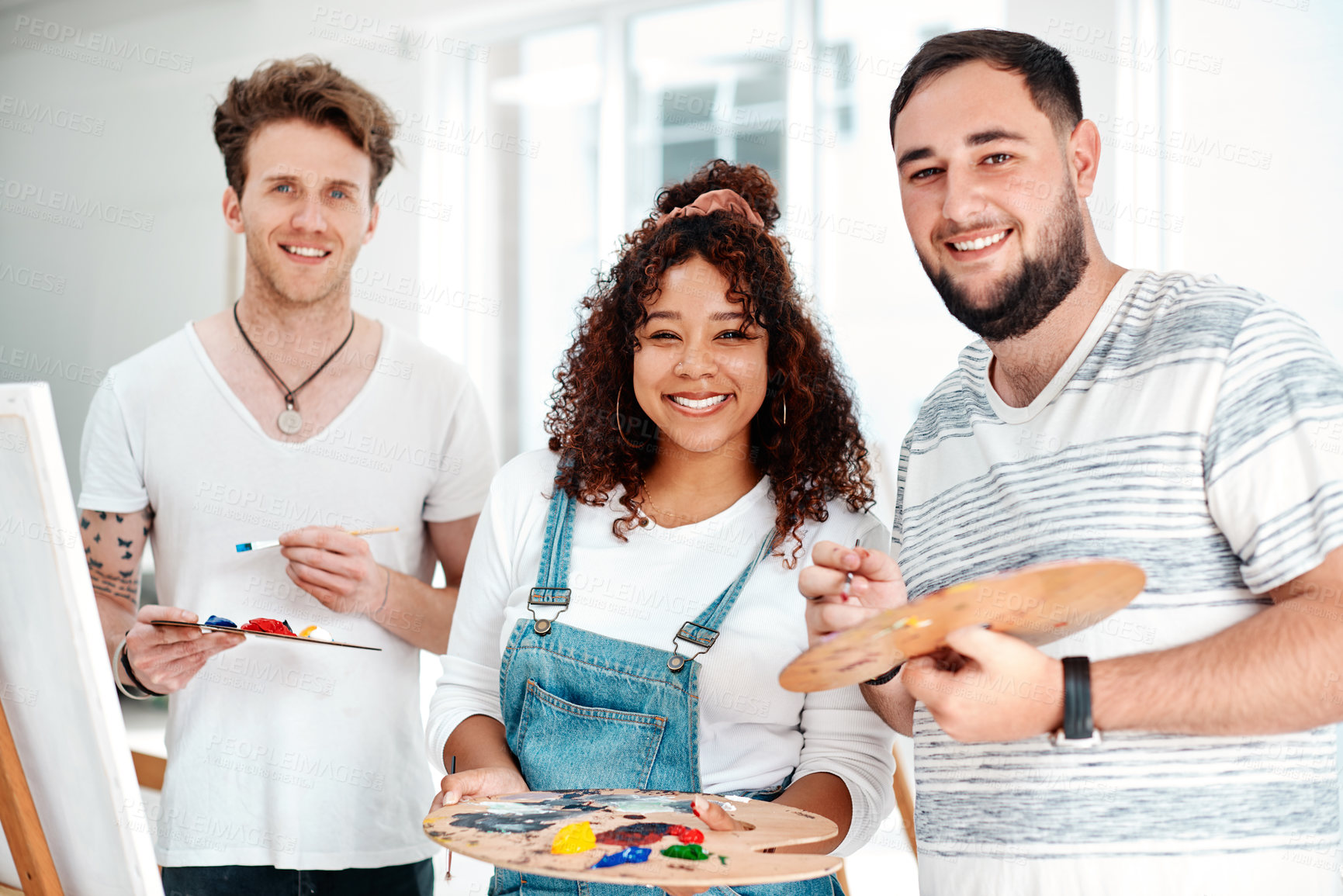 Buy stock photo Cropped portrait of a diverse group of artists standing together during an art class in the studio
