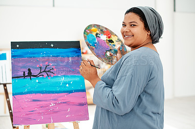 Buy stock photo Cropped portrait of an attractive young artist standing alone and painting during an art class in the studio