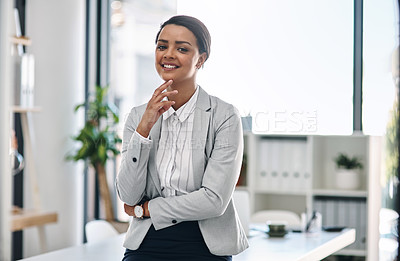 Buy stock photo Portrait of an attractive young businesswoman feeling confident and cheerful while working in her office