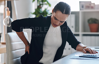 Buy stock photo Frustrated woman, back injury and pain with posture for muscle tension or spine inflammation at office desk. Female person, worker or business employee with sore bruise, ache or sprain at workplace