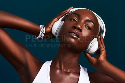 Buy stock photo Black woman, headphones and relax with exercise music, workout and fitness playlist in studio. Streaming, radio and song with athlete training and wellness with internet audio with dark background