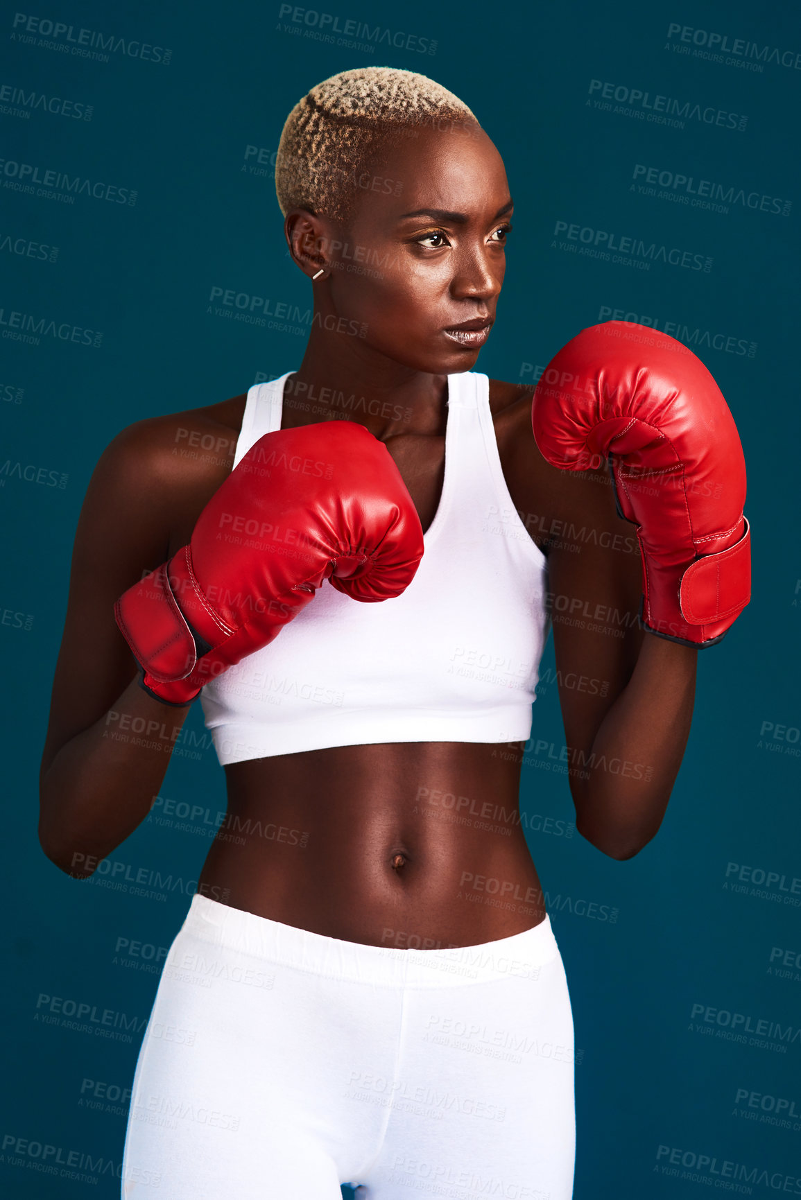 Buy stock photo Studio, black woman and fist with gloves for boxing, mma workout or prepare for fight competition. Fitness, female person and boxer with training for punch, resilience or challenge by dark background