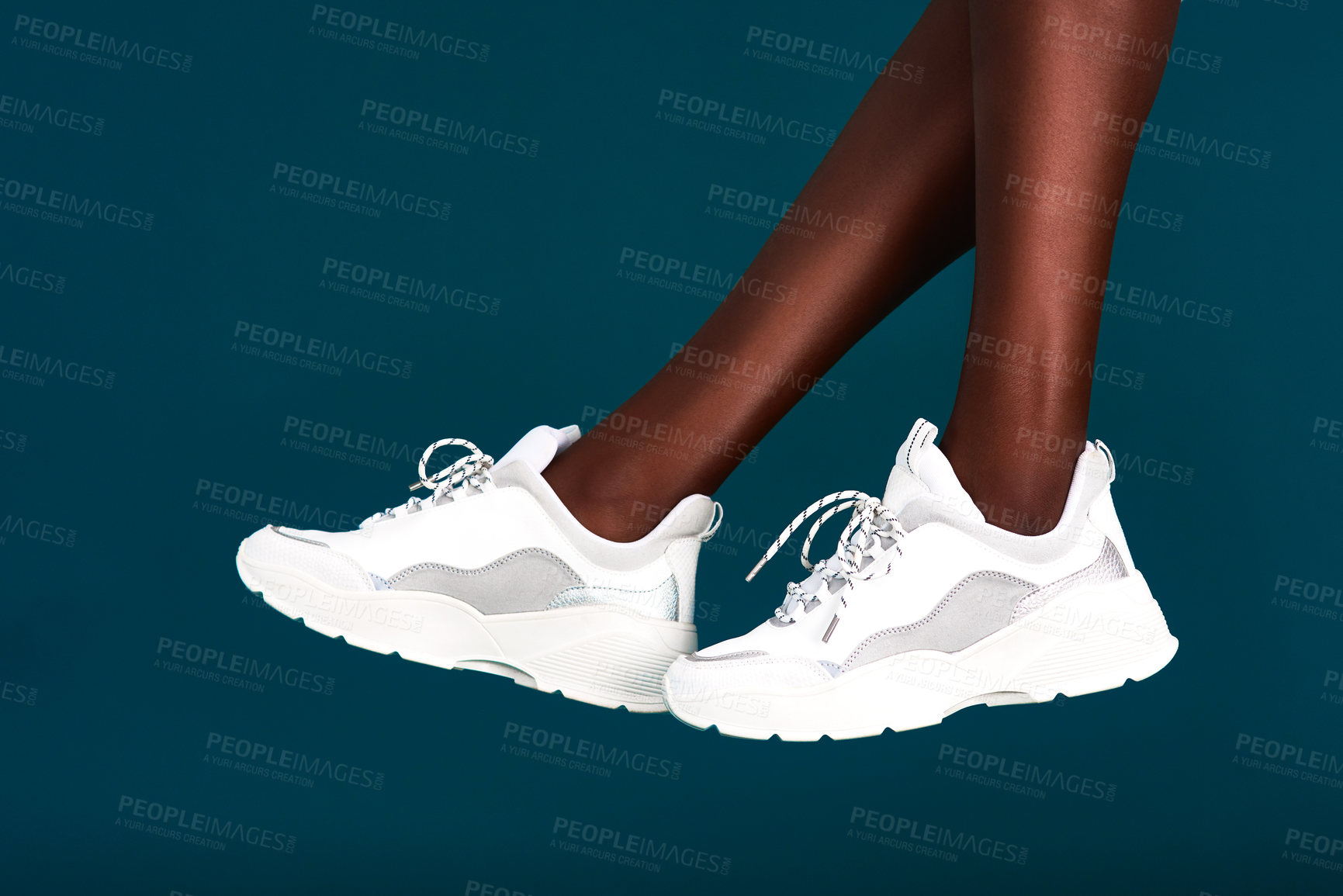 Buy stock photo Legs, sports or shoes in studio with person, fitness or gear for workout, fashion or training. Ready, footwear closeup or athlete with sneakers for exercise performance on dark or blue background