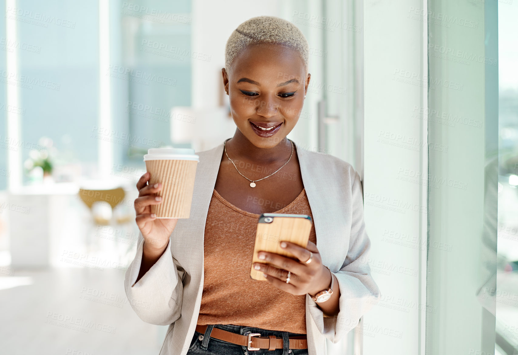 Buy stock photo Black woman, business and smartphone in office with smile, coffee cup and texting, networking or social media. African, female person and employee at company as project manager in corporate on tech