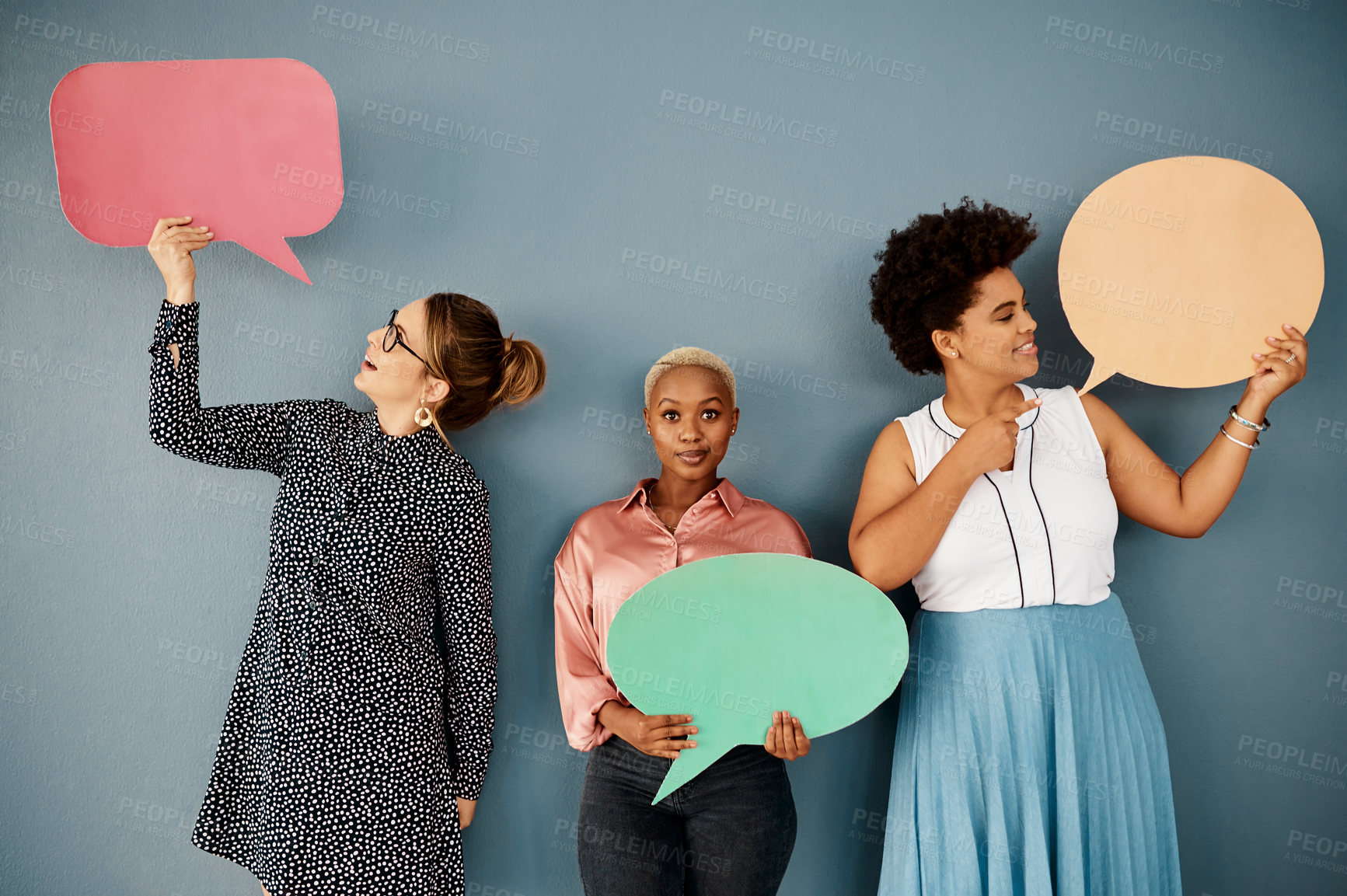 Buy stock photo Business people, chat and speech bubble on wall background for social media, networking or communication. Group or woman in portrait with quote poster, opinion or feedback on mockup space in studio