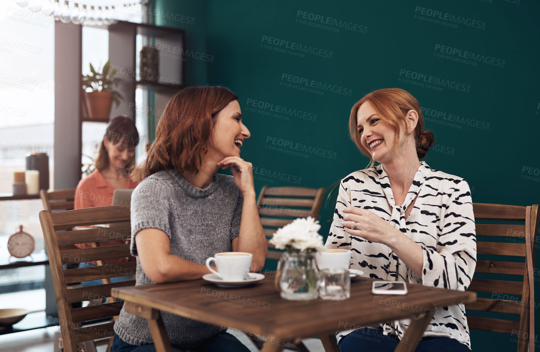 Buy stock photo Cropped shot of two attractive middle aged women having a coffee date together as friends inside of a coffee shop during the day