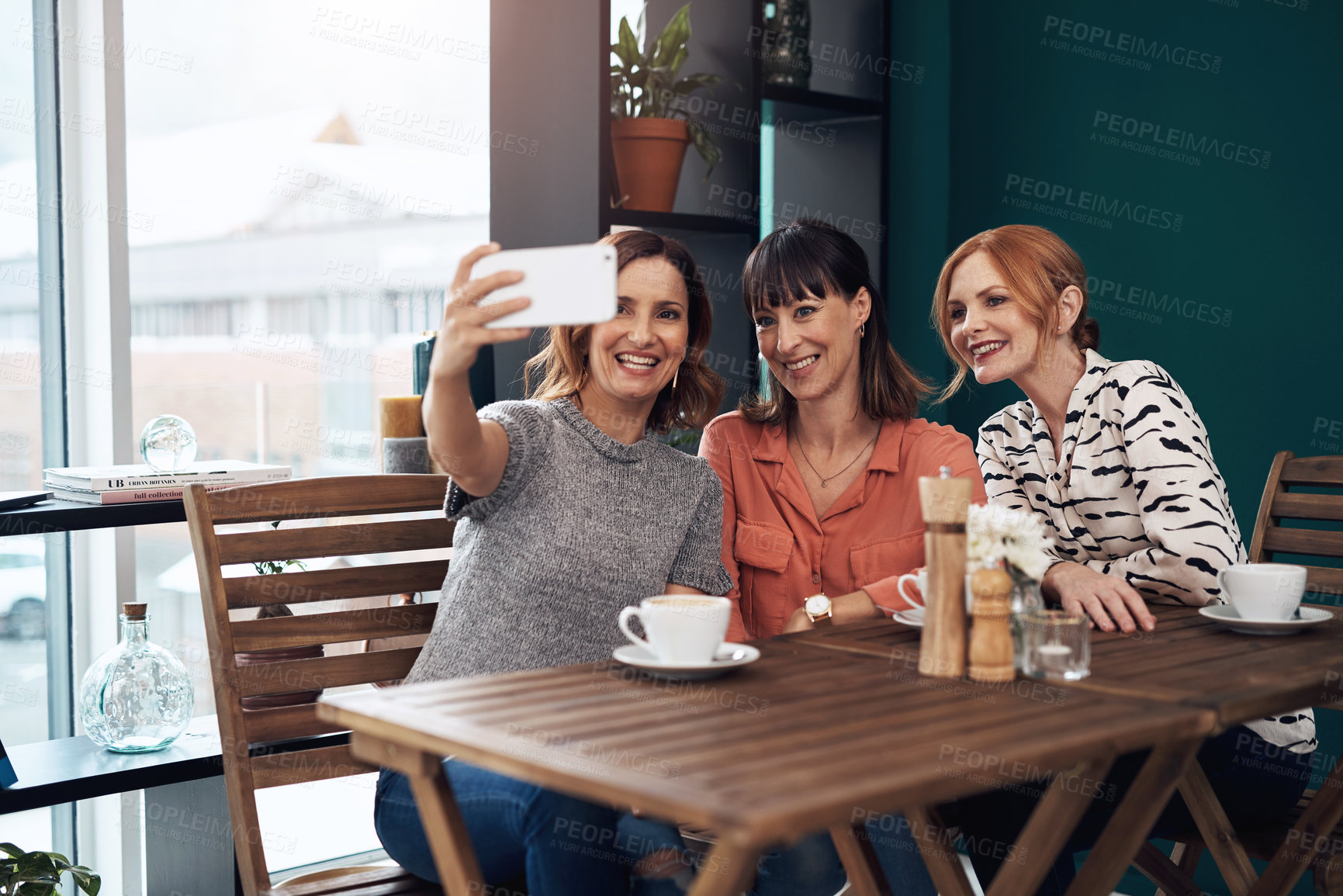 Buy stock photo Selfie, women and together in coffee shop for connection, social media and friends in city. Smile, technology and reunion in restaurant for memory, blog and post or story with people in New York