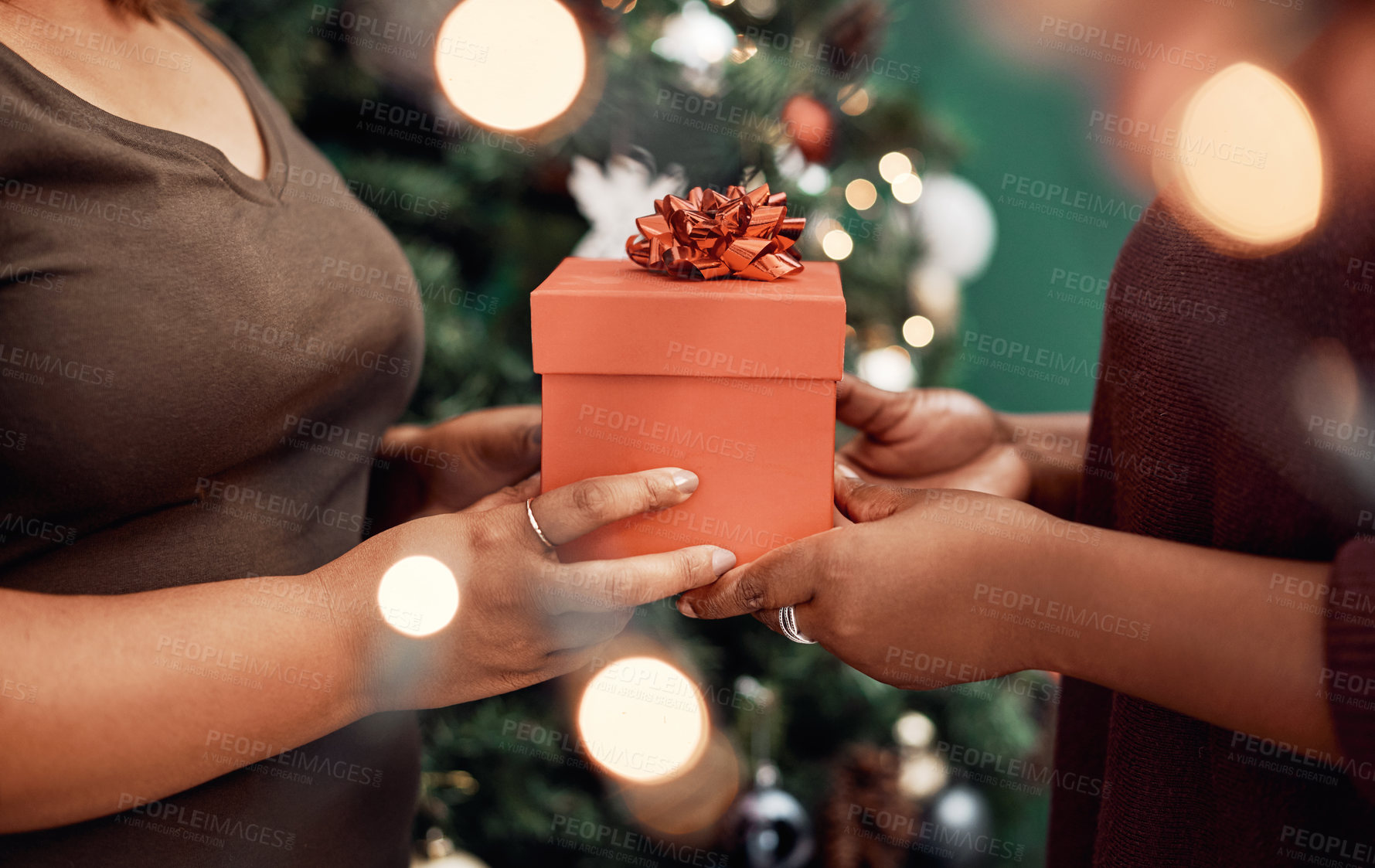 Buy stock photo Hands, gift and Christmas party for celebration, holiday and festive as happy friends in home. Female people, together and presents with season, sharing or solidarity for relationship in December