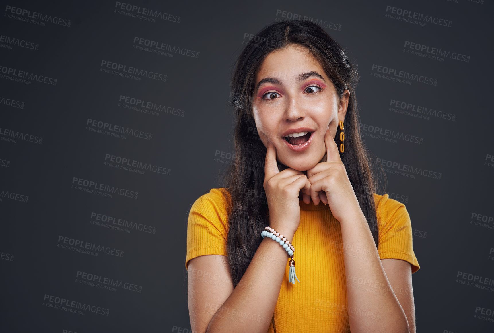 Buy stock photo Funny, makeup or girl in studio with silly face, good mood and confidence, playful or quirky personality on black background. Hands, cheek or teenage model with cmic, joke or humor, cosmetics or glow