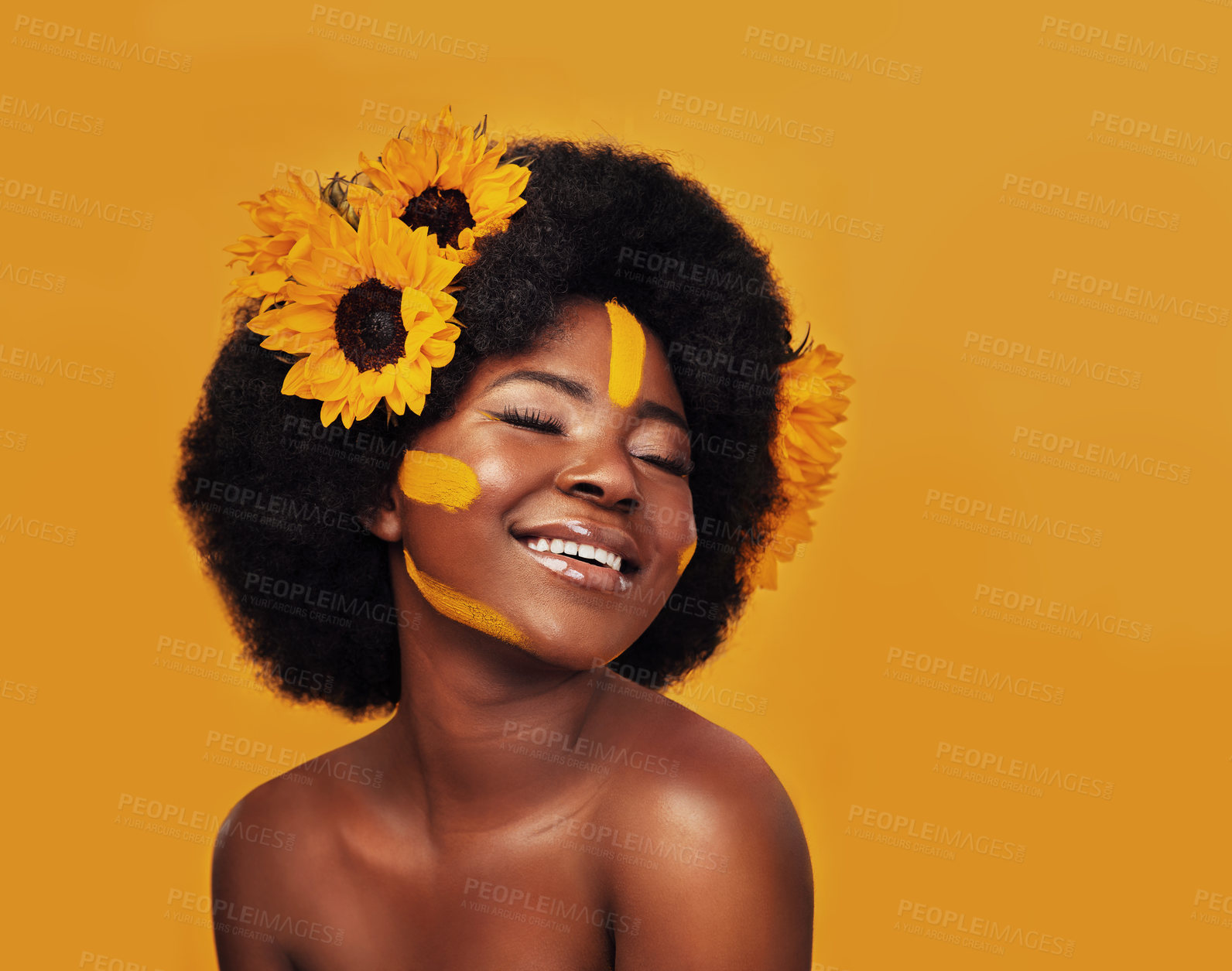 Buy stock photo Black woman, studio and sunflower for skincare with glow, natural cosmetics and soft skin. Floral, person and eyes closed with smile for organic, dermatology and vitamin e on yellow background