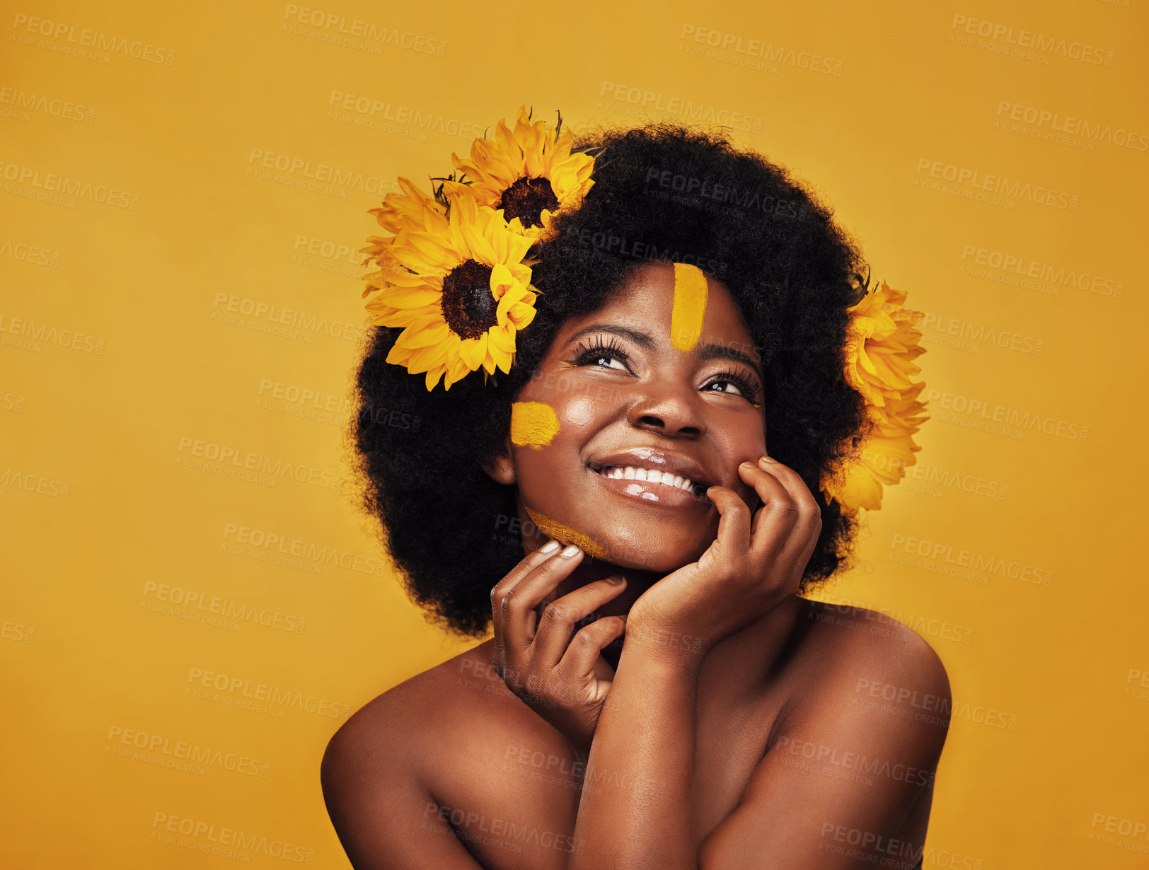 Buy stock photo Black person, studio and sunflower with natural skincare for vitamin e, treatment or soft skin. Floral glow, confidence and woman with plant for organic, cosmetics or dermatology on yellow background