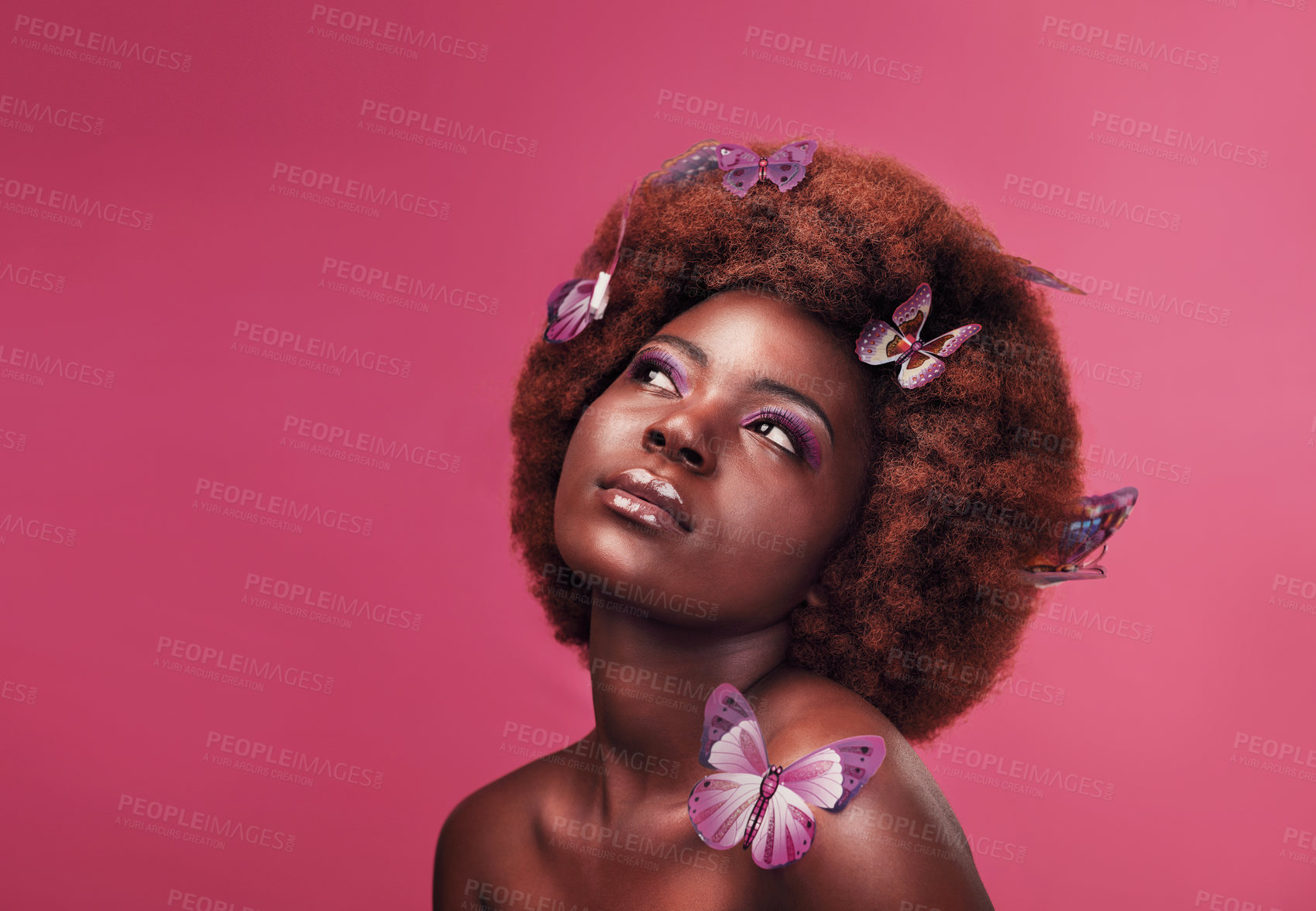 Buy stock photo Beauty, cosmetics and black woman with butterflies in studio with creative, art and fantasy. Makeup, thinking and female model from Nigeria with insects for facial cosmetology by pink background.