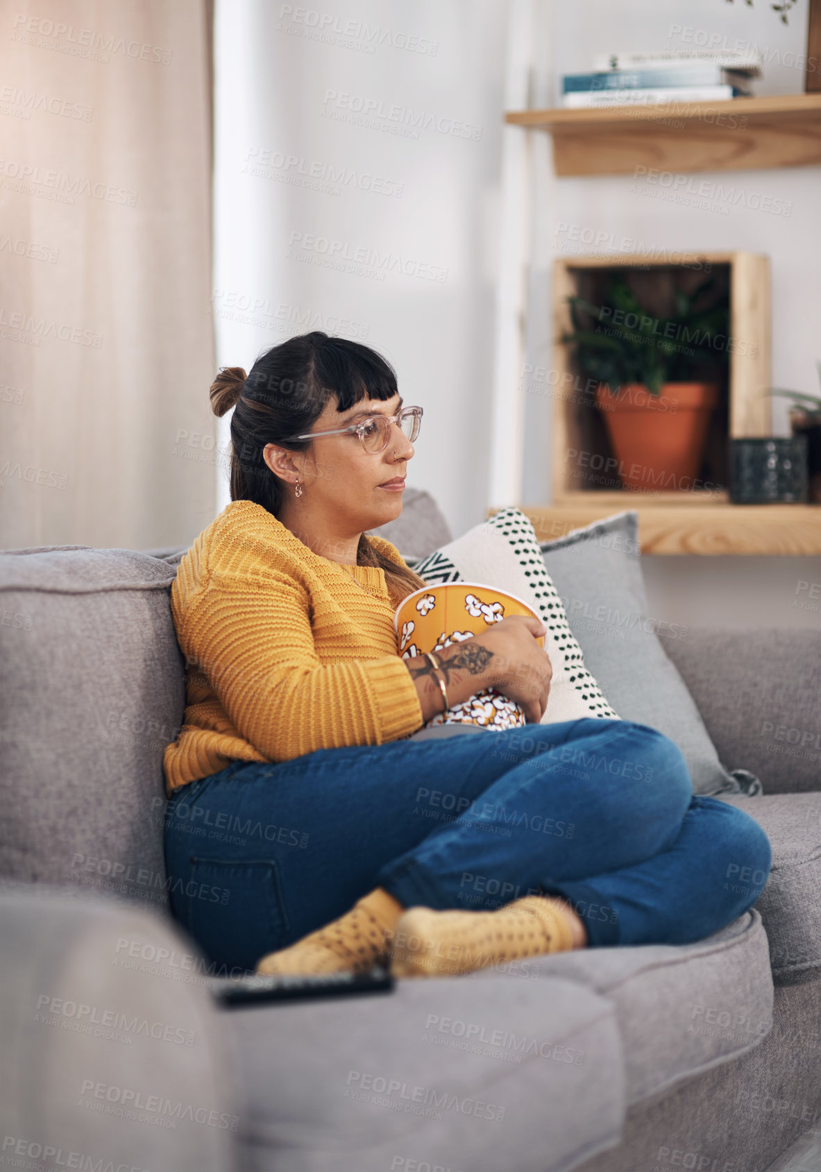 Buy stock photo Relax, popcorn and woman watching tv on sofa with glasses for movie, film or streaming series in her home. Cable, service or girl person in living room with theater snack for television, news or show