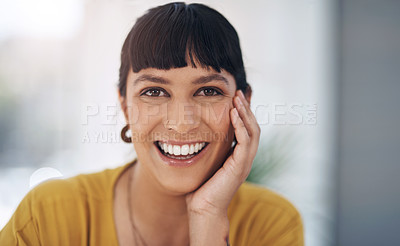 Buy stock photo Cropped portrait of an attractive young businesswoman sitting alone in her office during the day