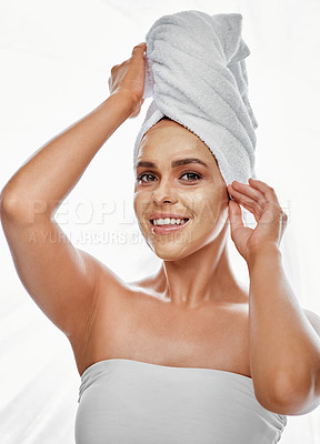 Buy stock photo Shot of a beautiful young woman wearing a face mask  against a white background