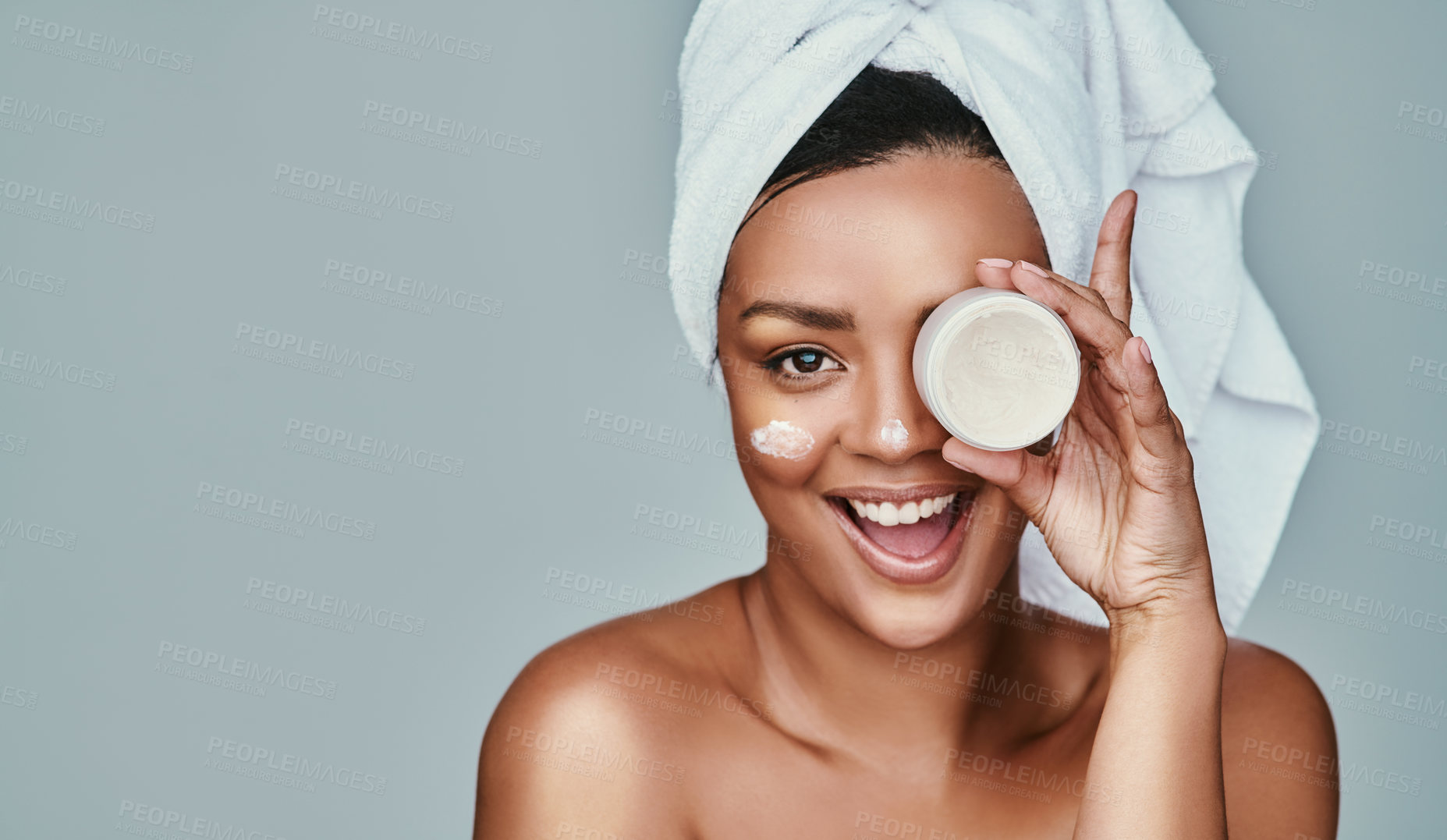 Buy stock photo Portrait, happy woman or cream with skincare space for cleaning cosmetics for beauty or detox. White background, towel or excited model with facial product for antiaging mockup in studio in Spain