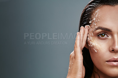 Buy stock photo Shot of a beautiful young woman posing with salt on her face