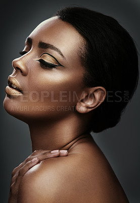 Buy stock photo Beauty, gold makeup and face of black woman in studio for wellness, skincare and dermatology. Salon aesthetic, spa and profile of African person with cosmetics, glamour and shine on gray background