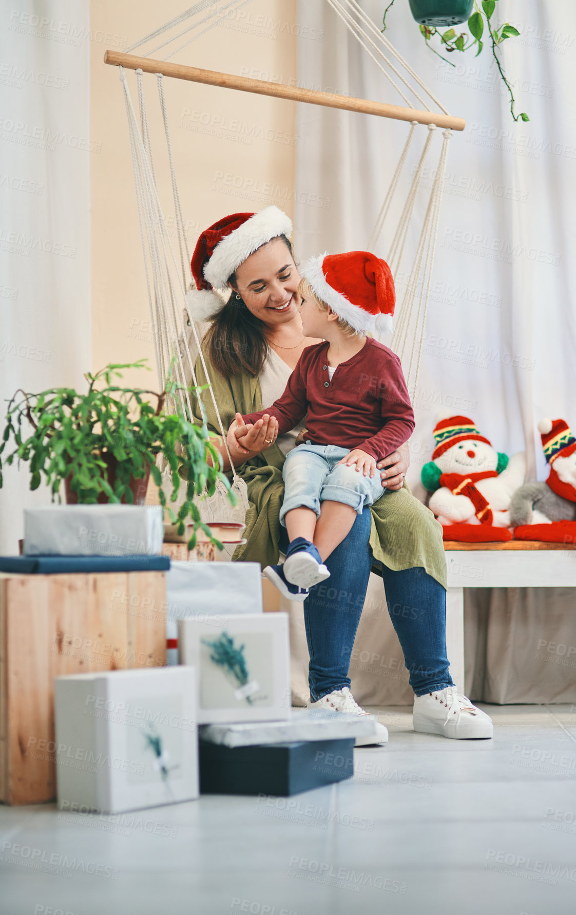 Buy stock photo Woman, bonding and boy in house for Christmas holiday, happy and relax with gifts or presents. Mother, child and talking on chair in home for vacation with family, decor and festive celebration