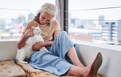 Buy stock photo Senior woman relax with her cat on home floor for mental health, wellness or emotional support, love and care. Elderly person in retirement scratch or cuddle pet, animal or kitten by house or window