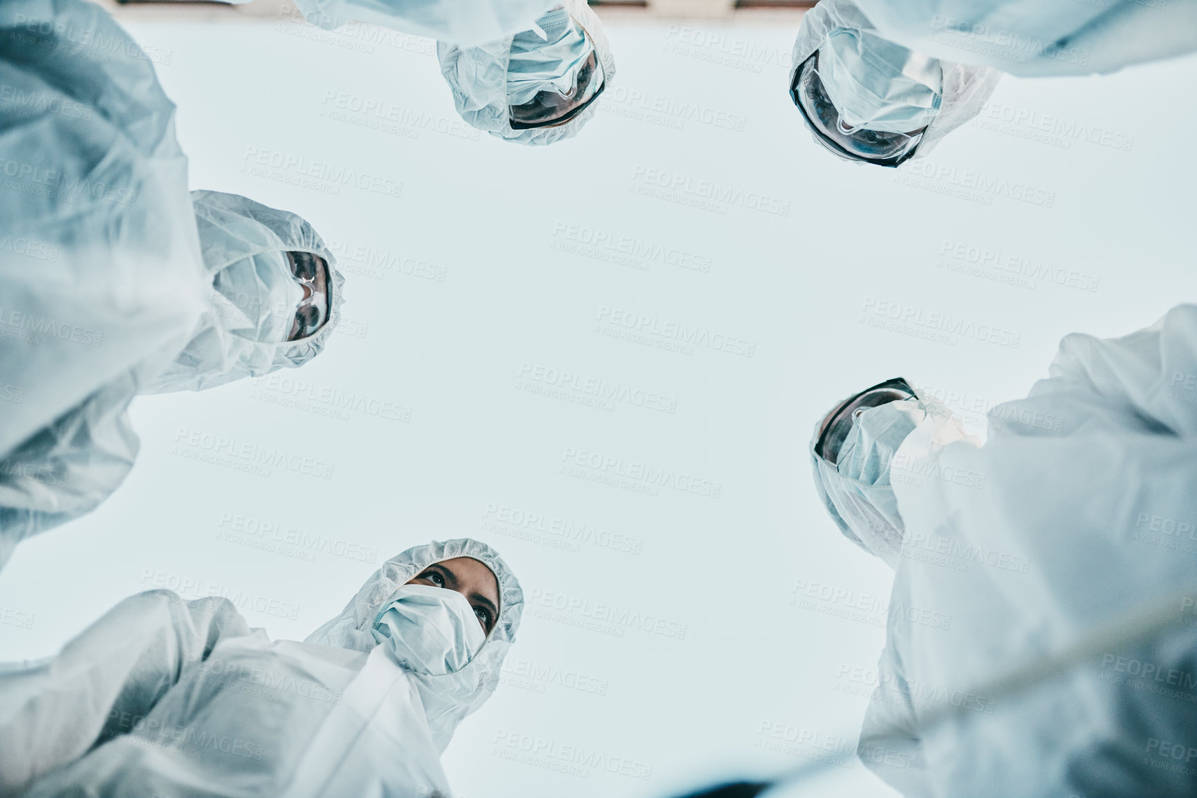 Buy stock photo Covid pandemic outbreak team of doctors or medical workers wearing protective ppe to prevent spread of virus in hospital. Group of scientists wearing hazmat suits for corona or ebola disease in lab.
