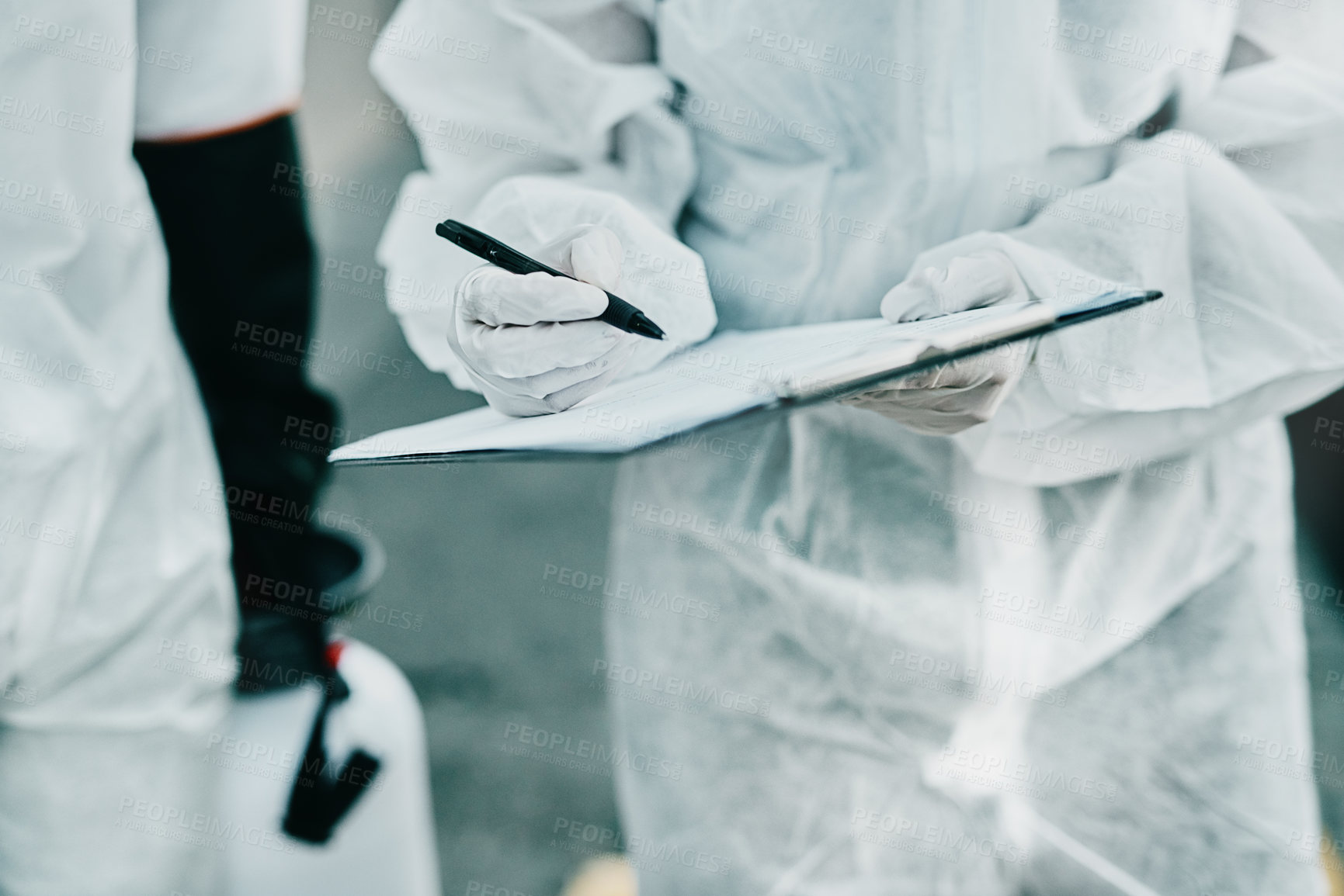 Buy stock photo Shot of healthcare workers wearing hazmat suits working together to control an outbreak