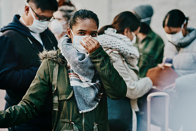 Buy stock photo Shot of a group of young people wearing masks while travelling in a foreign city