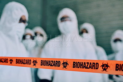 Buy stock photo Shot of a group of healthcare workers wearing hazmat suits working together to control an outbreak