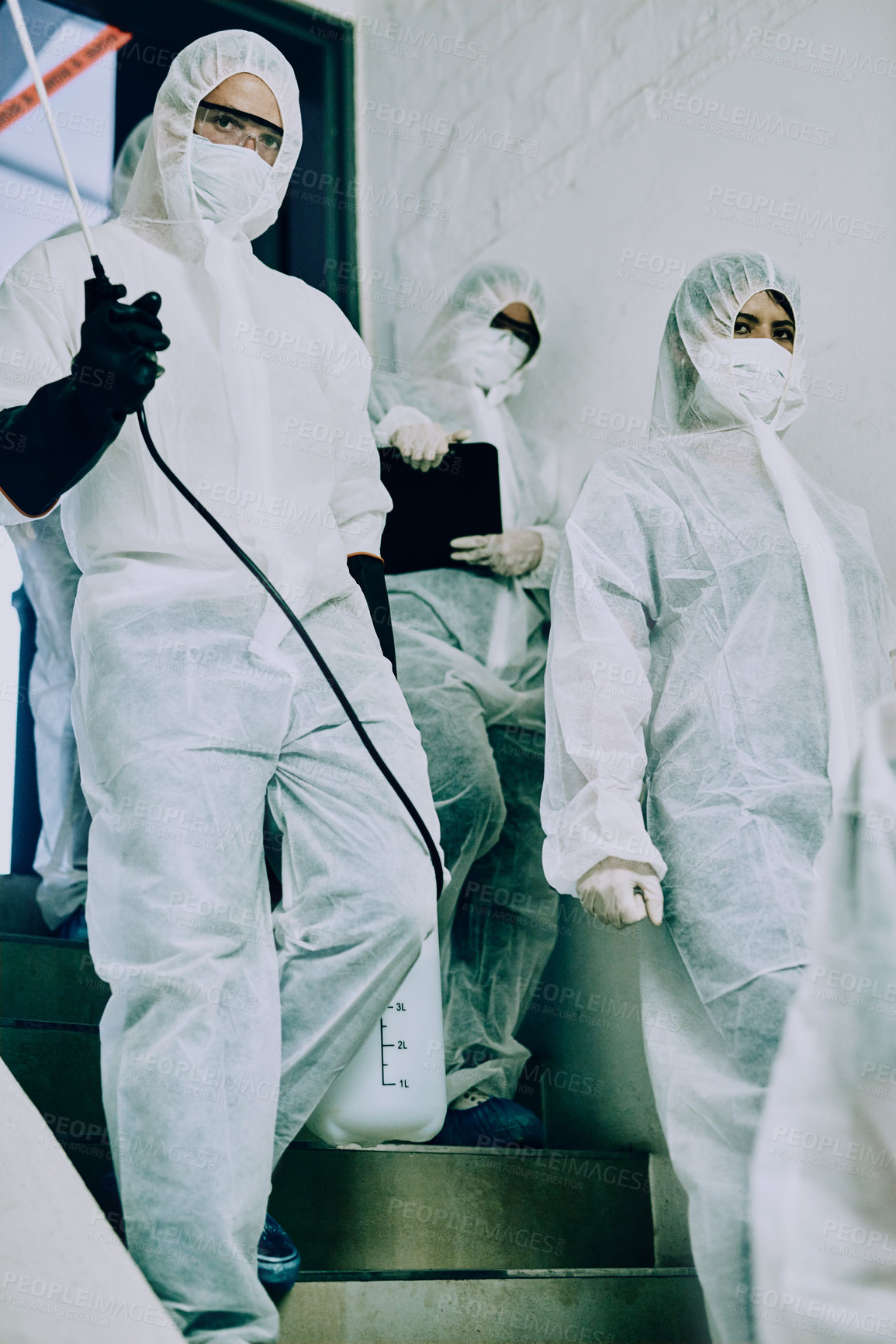 Buy stock photo Safety, protection and group of doctors walking with scientists in hazmat ppe to prevent spread of virus. Virologist, medical workers or people on stairs for healthcare, covid or pandemic disease