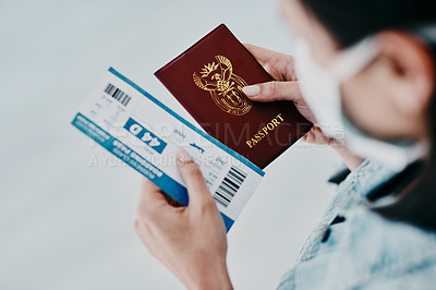 Buy stock photo Travel, covid and tourist visa or passport while holding a plane flight ticket with face mask at airport for immigration. Closeup of female traveler holding ID for traveling during corona pandemic 