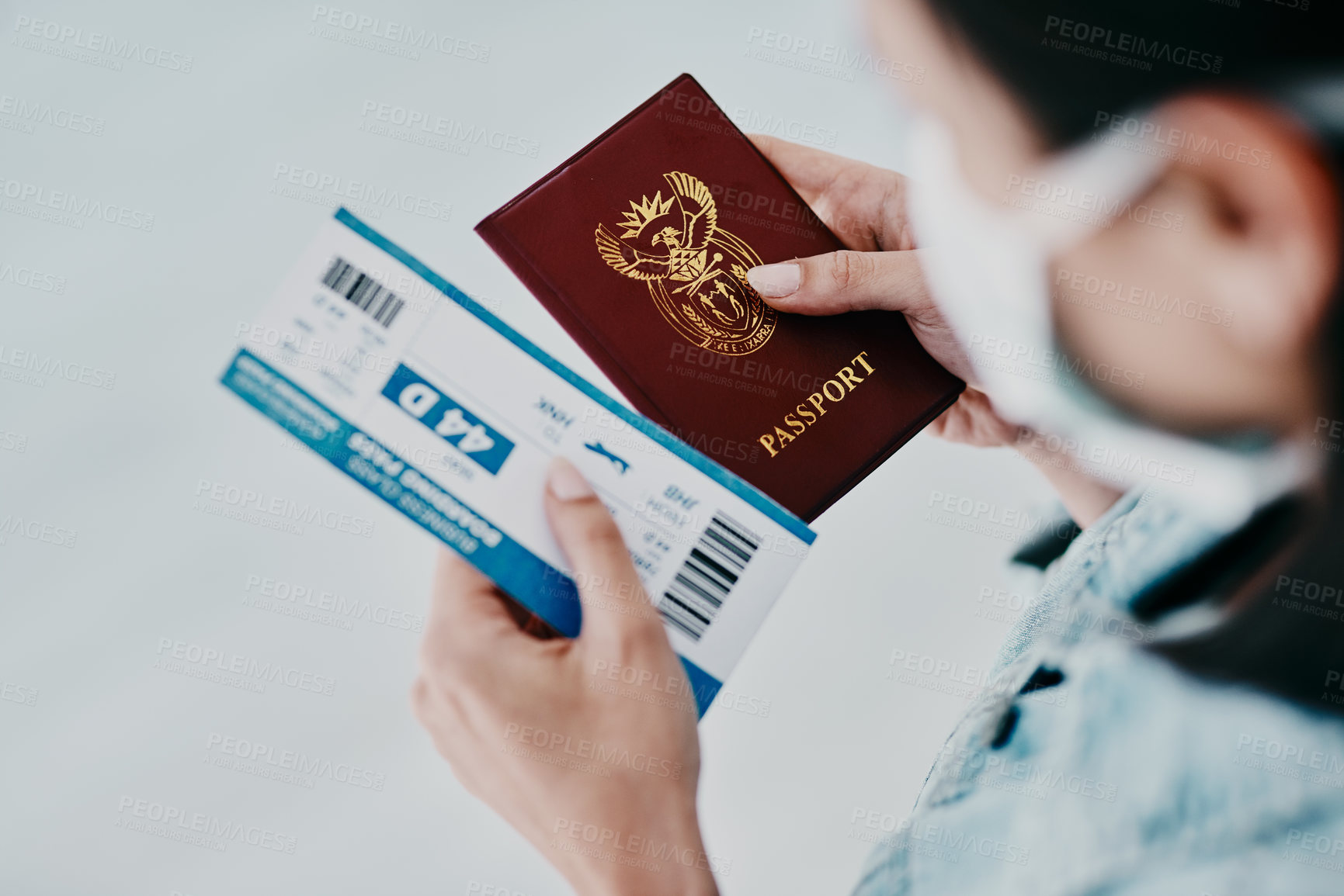 Buy stock photo Travel, covid and tourist visa or passport while holding a plane flight ticket with face mask at airport for immigration. Closeup of female traveler holding ID for traveling during corona pandemic 