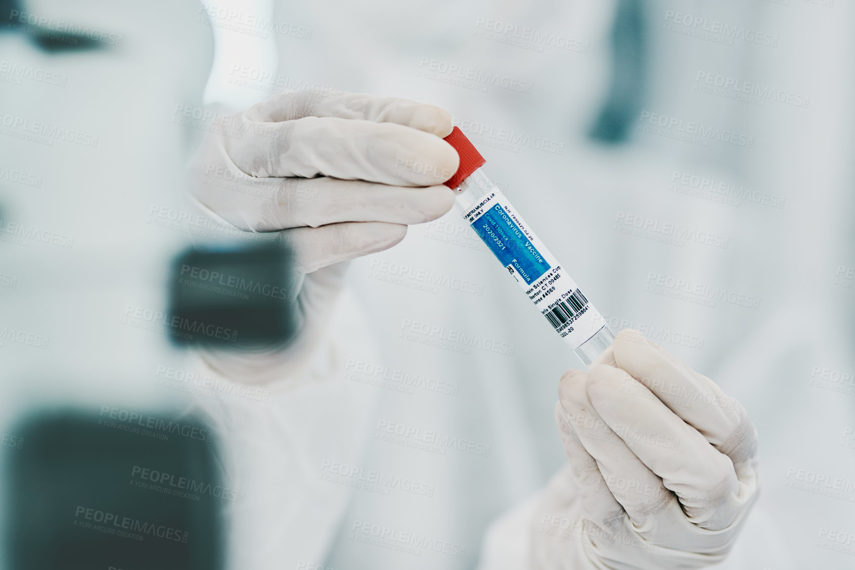 Buy stock photo Cropped shot of a scientist holding a vial while conducting medical research in a laboratory