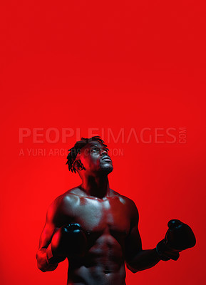 Buy stock photo Red filtered shot of a sportsman  wearing boxing gloves