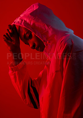 Buy stock photo Fashion, woman and red lighting in studio with cool, modern and trendy urban outfit with confidence. Neon, art and creativity with sport, rain racket and gen z style with edgy clothes and model