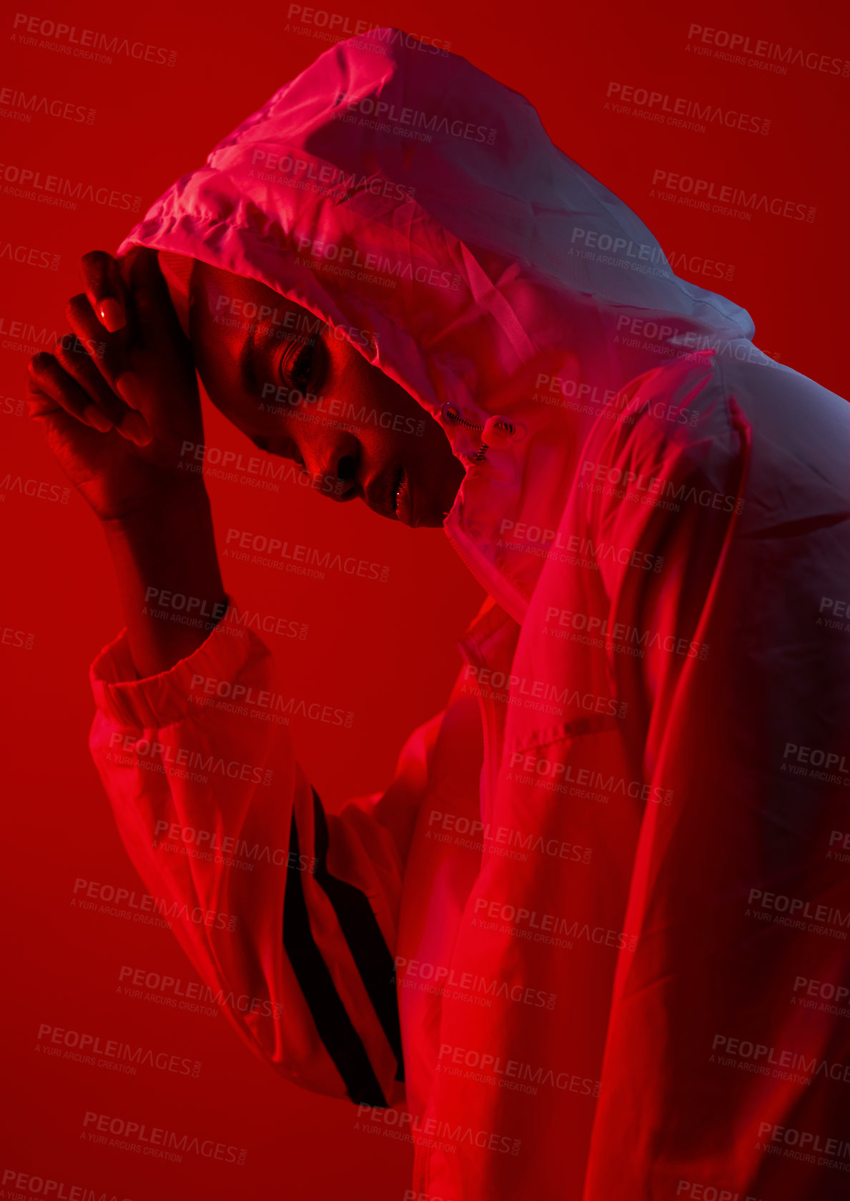 Buy stock photo Fashion, woman and red lighting in studio with cool, modern and trendy urban outfit with confidence. Neon, art and creativity with sport, rain racket and gen z style with edgy clothes and model