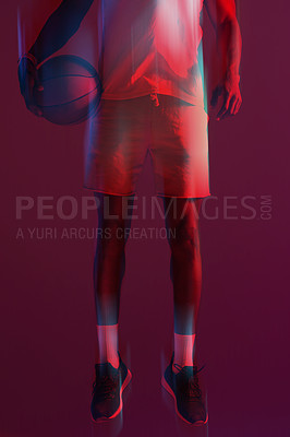Buy stock photo Red filtered shot of an unrecognizable sportsman posing with a basketball in the studio