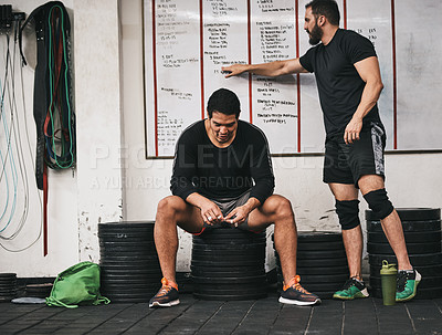 Buy stock photo Shot of people taking a break in a gym