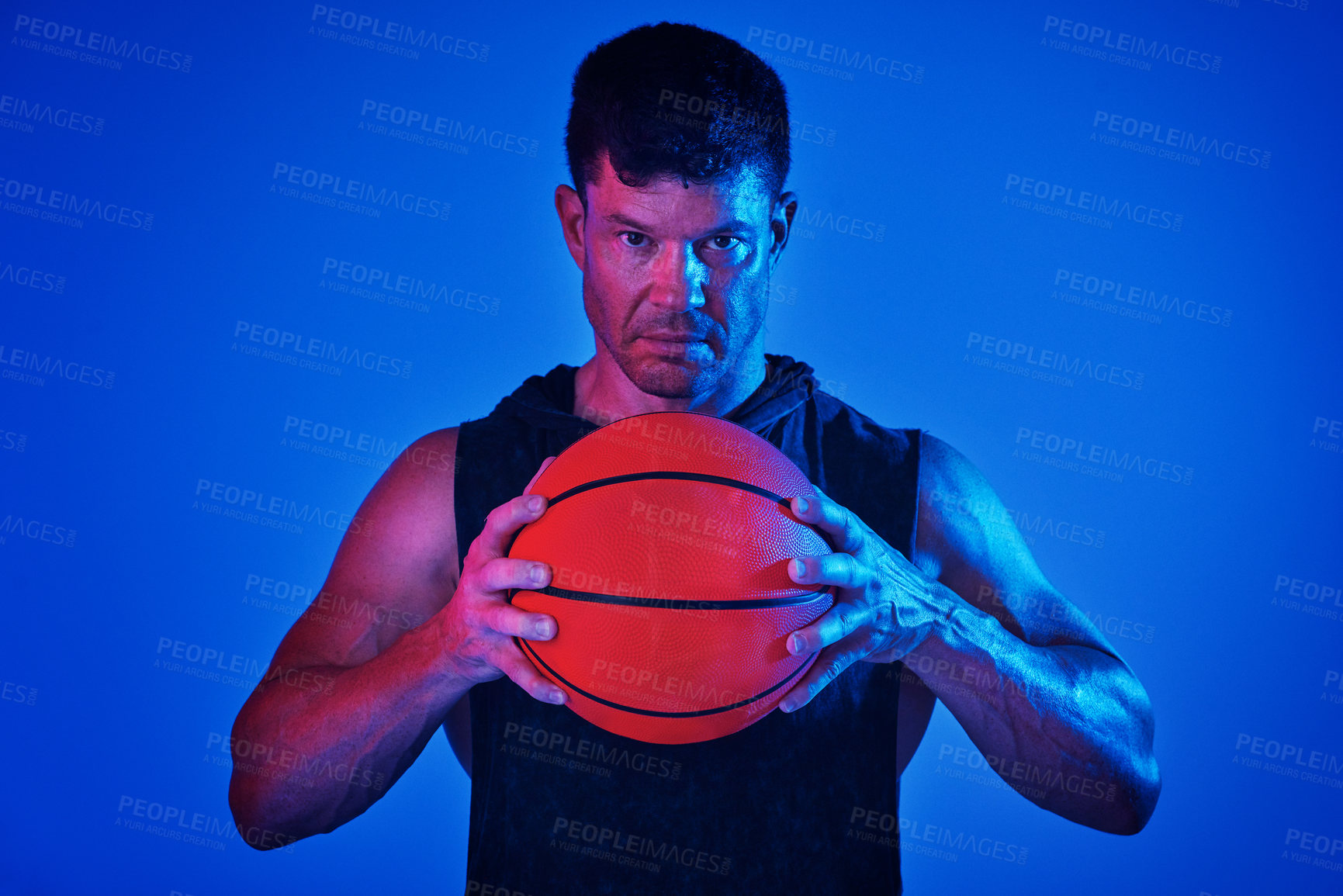 Buy stock photo Man, basketball and portrait in studio for training, fitness and thinking with sweat by blue background. Person, athlete and ball for games, development and exercise with burnout for sports in Spain