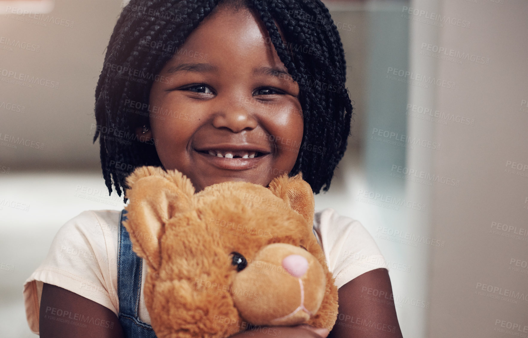 Buy stock photo Smile, portrait and girl in home with teddy bear, hug and playful with toy with happiness. Black child, comfort and companion with stuffed animal for childhood, sentimental value and friends in house