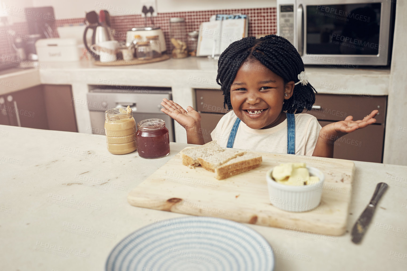 Buy stock photo Portrait of an adorable little girl making lunch for herself in the kitchen at home