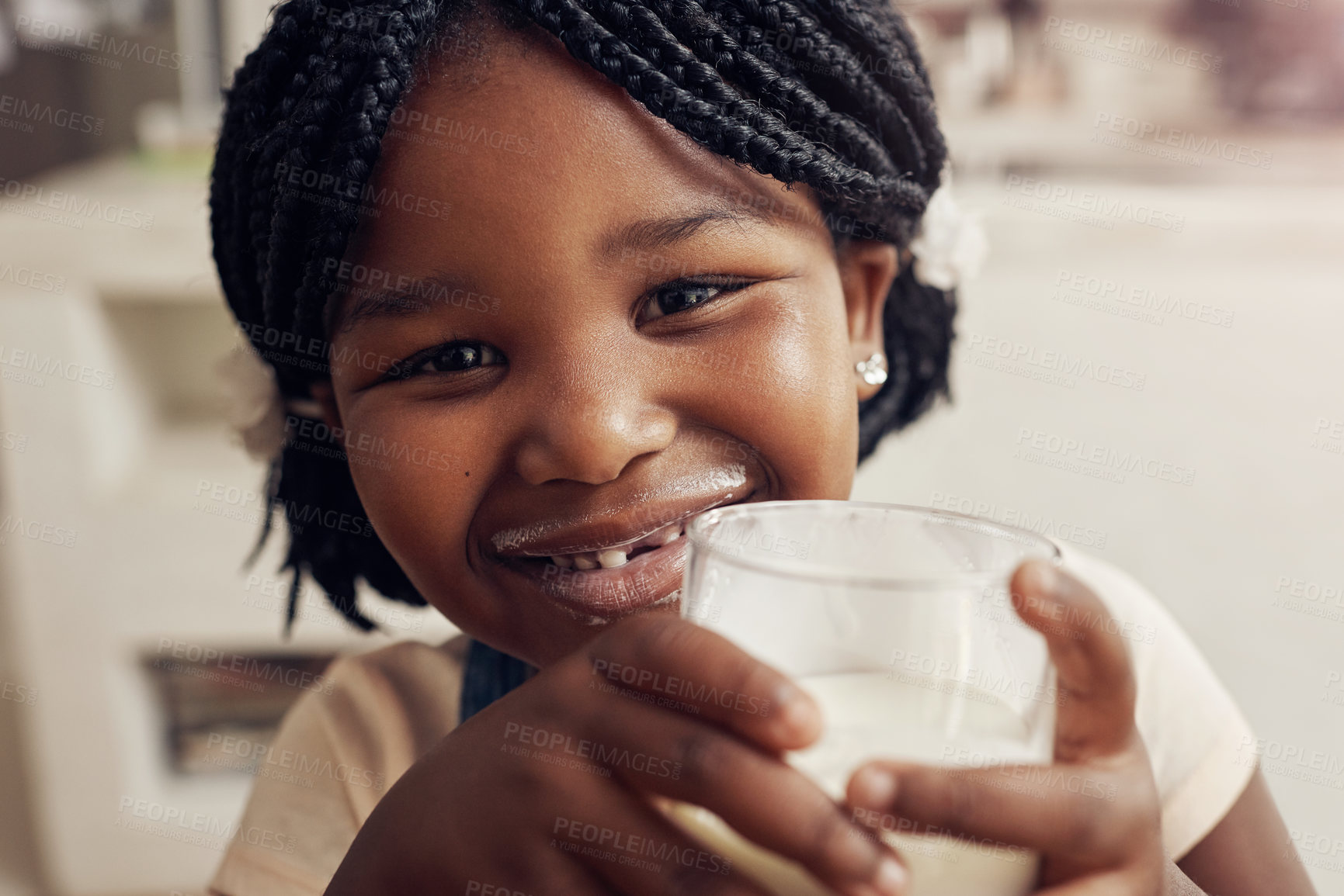 Buy stock photo Black girl, drink milk and portrait in home for nutrition, hygiene and dental health in kitchen. Family house, child and glass of dairy product for wellness, protein and vitamins for growth for kid